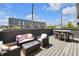 Enjoy outdoor living on this patio featuring comfortable seating, a dining table, and views of the neighborhood at 1702 Alvord St, Indianapolis, IN 46202