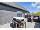 Relax and entertain on this patio with a dining table, comfortable seating, and modern design at 1702 Alvord St, Indianapolis, IN 46202