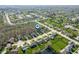 Beautiful aerial view of neighborhood featuring many green lawns, tree-lined streets, and ponds at 17027 Rainier Cir, Westfield, IN 46062