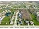 Attractive aerial view featuring a neighborhood with ponds, tree-lined streets, and lawns at 17027 Rainier Cir, Westfield, IN 46062