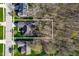 Aerial view of property showing its location in a neighborhood with mature trees and proximity to surrounding streets at 17027 Rainier Cir, Westfield, IN 46062