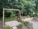Backyard with a fire pit, landscaping, and trees at 17027 Rainier Cir, Westfield, IN 46062
