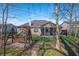 Landscaped backyard with a swing set, screened-in porch, and mature trees at 17027 Rainier Cir, Westfield, IN 46062