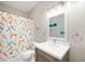 Bathroom featuring a mermaid shower curtain, modern sink, and bright lighting at 17027 Rainier Cir, Westfield, IN 46062