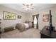 Neutral bedroom with carpet, ceiling fan, and a window bringing in natural light at 17027 Rainier Cir, Westfield, IN 46062
