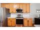 Modern kitchen with stainless steel appliances, light wood cabinets, and white backsplash, providing a clean and functional space at 17027 Rainier Cir, Westfield, IN 46062