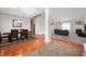 Open-concept living room and dining area with hardwood floors, neutral carpet, and plenty of natural light at 17027 Rainier Cir, Westfield, IN 46062