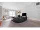 Bright living room with high ceilings, a modern fireplace, a large sofa and a wall-mounted TV at 17027 Rainier Cir, Westfield, IN 46062
