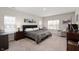 Spacious main bedroom with carpet, neutral colors, and natural light from two windows at 17027 Rainier Cir, Westfield, IN 46062