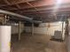 Unfinished basement with exposed beams and concrete floor, ready for customization at 1802 Poplar St, Anderson, IN 46012