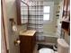 Traditional bathroom with a vanity and combined shower-tub, offering essential amenities at 1802 Poplar St, Anderson, IN 46012