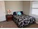 Well-lit bedroom featuring a comfortable bed and stylish nightstand for relaxed living at 1802 Poplar St, Anderson, IN 46012