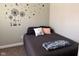 Relaxing bedroom setting with a soft bed and charming decorative wall art at 1802 Poplar St, Anderson, IN 46012