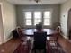 Dining area showcasing a wooden table, comfortable seating, and plenty of natural light at 1802 Poplar St, Anderson, IN 46012