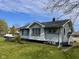 View of a quaint home with well-maintained siding and landscaping at 1802 Poplar St, Anderson, IN 46012