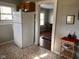 Cozy kitchen with classic cabinetry and appliances, next to an inviting dining area at 1802 Poplar St, Anderson, IN 46012