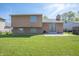 Spacious backyard featuring a well-manicured lawn, chain-link fence, and a patio area at 18771 Northridge Dr, Noblesville, IN 46060