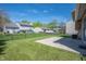 Lush backyard showcasing a green lawn, patio, and a secure chain-link fence for privacy at 18771 Northridge Dr, Noblesville, IN 46060