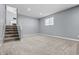 Spacious room in basement with carpet, stairway and window at 18771 Northridge Dr, Noblesville, IN 46060