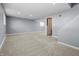 Spacious finished basement features neutral carpet, white trim, and ample natural light at 18771 Northridge Dr, Noblesville, IN 46060