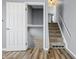 View of the entryway with wood-look flooring, stairs and open door at 18771 Northridge Dr, Noblesville, IN 46060
