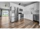 Modern kitchen featuring stainless steel appliances, white cabinets, and access to the backyard at 18771 Northridge Dr, Noblesville, IN 46060