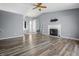 Spacious living room featuring modern flooring, a fireplace, and seamless transition to the entryway at 18771 Northridge Dr, Noblesville, IN 46060