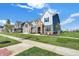 Charming new home features a brick facade, well-kept lawn, and beautiful landscaping at 19472 Lewis Cir, Westfield, IN 46074
