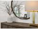 Close up of foyer console table with vase, mirror, and lamp at 19472 Lewis Cir, Westfield, IN 46074