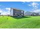 Expansive backyard with green lawn, ideal for outdoor gatherings, showcasing the property's generous space at 19492 Lewis Cir, Westfield, IN 46074
