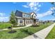 Charming two-story home featuring a well-kept lawn and inviting pathway to the front door at 19492 Lewis Cir, Westfield, IN 46074