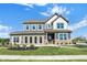 Two-story home with brick and siding details, manicured lawn, and inviting front entrance at 19492 Lewis Cir, Westfield, IN 46074