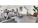Bright and airy living room with open floor plan, stylish furnishings, and easy access to the dining area at 19492 Lewis Cir, Westfield, IN 46074