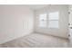 Neutral bedroom featuring carpet, a window, and a door leading to another room at 19522 Wood Farm Pl, Westfield, IN 46074