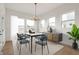 Elegant dining room with stylish furniture, natural light, and modern chandelier creating a cozy atmosphere at 19522 Wood Farm Pl, Westfield, IN 46074