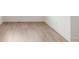 Close up of flooring showcasing the pristine, light wood floors and clean baseboards throughout the home at 19522 Wood Farm Pl, Westfield, IN 46074