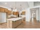 Modern kitchen features a large island, stainless steel appliances, and stylish cabinetry for a gourmet experience at 19522 Wood Farm Pl, Westfield, IN 46074