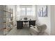 Bright home office with a large desk, stylish chair, and built-in shelving perfect for remote work at 19522 Wood Farm Pl, Westfield, IN 46074