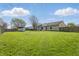Sprawling backyard showcases lush greenery, a privacy fence, and a convenient storage shed for all your needs at 250 3 Notch Ln, Bargersville, IN 46106