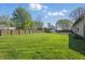 Large, fenced backyard offers plenty of green space for outdoor activities and features a shed for extra storage at 250 3 Notch Ln, Bargersville, IN 46106