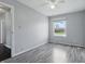 This bedroom features a ceiling fan, hardwood floors, and a window that brings in natural light at 250 3 Notch Ln, Bargersville, IN 46106