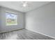 Bedroom featuring hardwood flooring, a ceiling fan, and a bright window at 250 3 Notch Ln, Bargersville, IN 46106