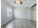 Bedroom with hardwood flooring, a ceiling fan, and natural light at 250 3 Notch Ln, Bargersville, IN 46106
