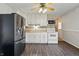 White kitchen with modern appliances, hardwood floors, and white cabinetry at 250 3 Notch Ln, Bargersville, IN 46106
