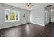 Bright living room featuring hardwood floors, a ceiling fan, and a bay window at 250 3 Notch Ln, Bargersville, IN 46106