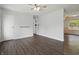 Spacious living room features hardwood floors, fresh paint, and a ceiling fan at 250 3 Notch Ln, Bargersville, IN 46106