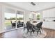 Dining area with sliding doors and hardwood floors and a view of outdoor patio at 279 Commodore Dr, Pittsboro, IN 46167