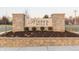Stone entrance sign displaying the name 'Hidden Hills' amidst landscaping, indicating a welcoming neighborhood at 279 Commodore Dr, Pittsboro, IN 46167