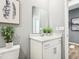 Clean bathroom featuring white cabinets, modern fixtures, and a decorative plant at 30 Benfield Dr, Whiteland, IN 46184