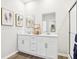 Modern bathroom featuring double sinks, elegant mirrors, and a glass shower at 30 Benfield Dr, Whiteland, IN 46184